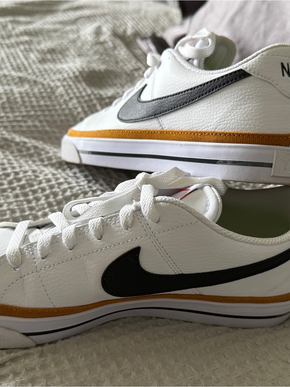 Nike Dunks Women’s White Sneakers with Black Swoosh and Gold Accent size 9